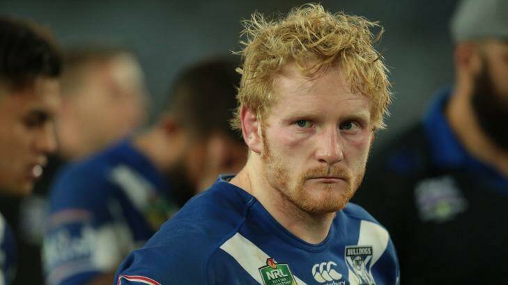 Down and out: Canterbury's James Graham comes to terms with defeat in the grand final. Photo: Christopher Chan