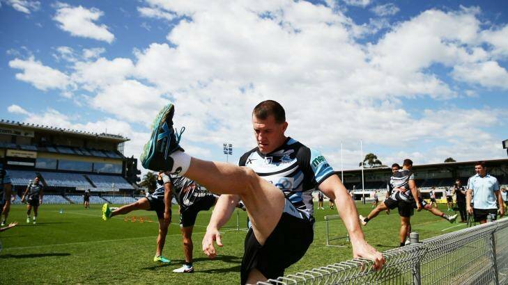No more clouds: Paul Gallen stretches during  Sharks training session. Photo: Matt King