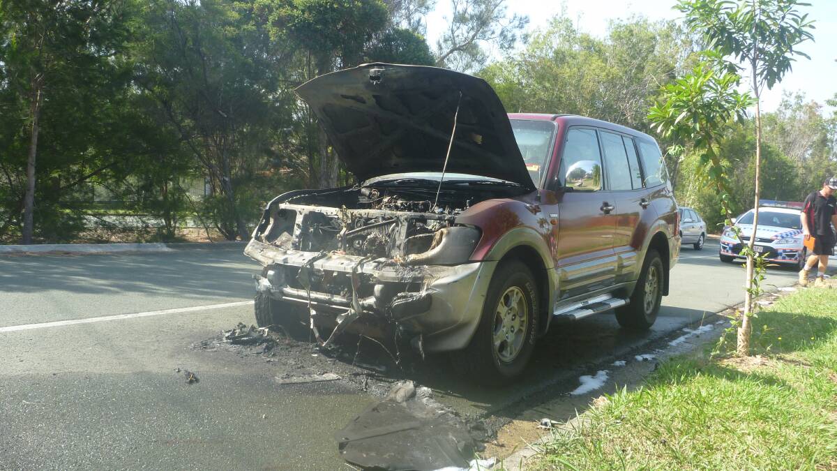 The remains of a four-wheel drive after an engine fire in Alexandra Hills on Thursday morning. Photo: Stephen Jeffery.