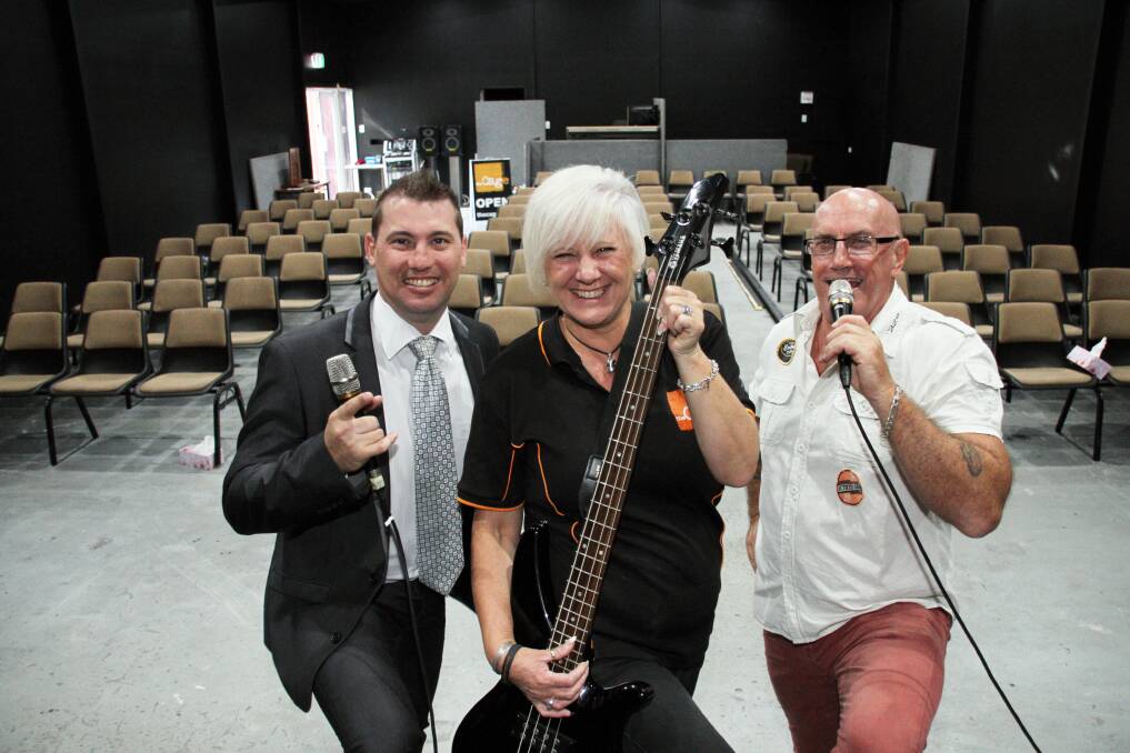 PLANS TO EXPAND: Celebrating their new relocation are (from left) one of the Cage's many supporters, Ray White Redland Bay principal Jesse James, and the Cage directors, Linda and Peter Grieve. Photo: Chris McCormack