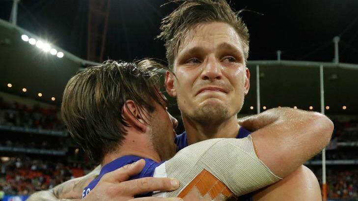 Clay Smith and Caleb Daniel embrace after the preliminary final. Photo: AFL Media/Getty Images
