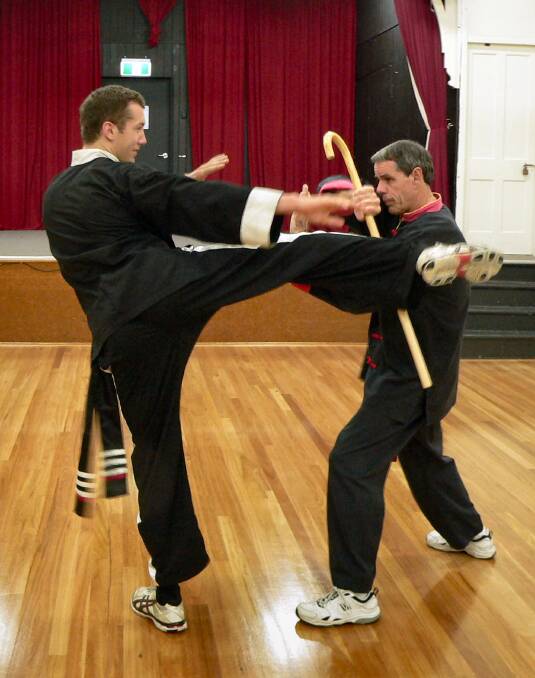 Michael Chess (left) and Sifu Neal Gilding practise at Black Crane Kung Fu school.