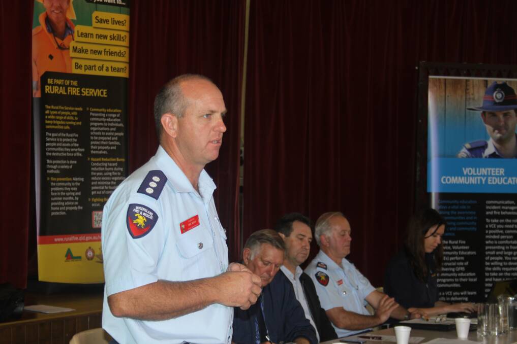 Rural Fire Service Queensland District Inspector Neil Kelso addresses a public meeting about creating a rural fire brigade on Straddie. Photo by Stephen Jeffery.