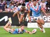 Sam Walker scores a try for the Roosters, who hammered St George Illawarra in the Anzac Day clash. (Dan Himbrechts/AAP PHOTOS)
