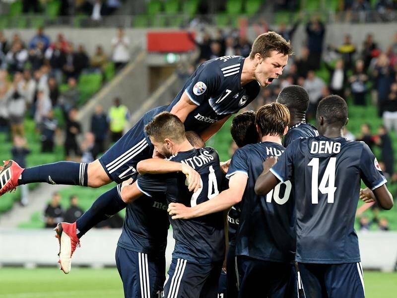 The Victory celebrate after Kosta Barbarouses' goal which kept their Champions League hopes alive.