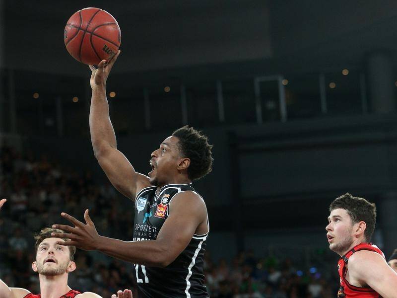 Casper Ware (C) has starred again for Melbourne United in their NBL win over the Perth Wildcats.