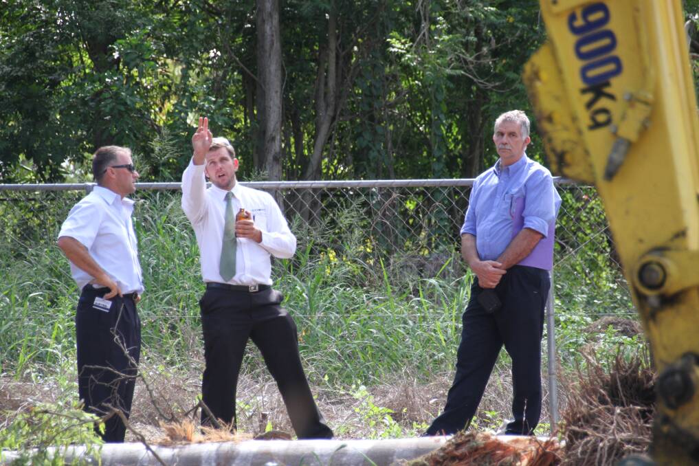 Council officers speak with Paul McManus at the Capalaba site where trees were removed without council approval. PHOTO: Chris McCormack