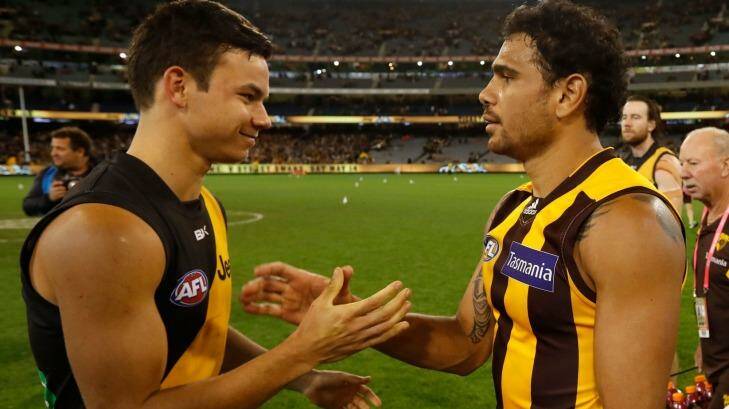 Meeting of Riolis: Daniel Rioli of the Tigers and Cyril Rioli of the Hawks greet each other after the game. Photo: AFL Media/Getty Images