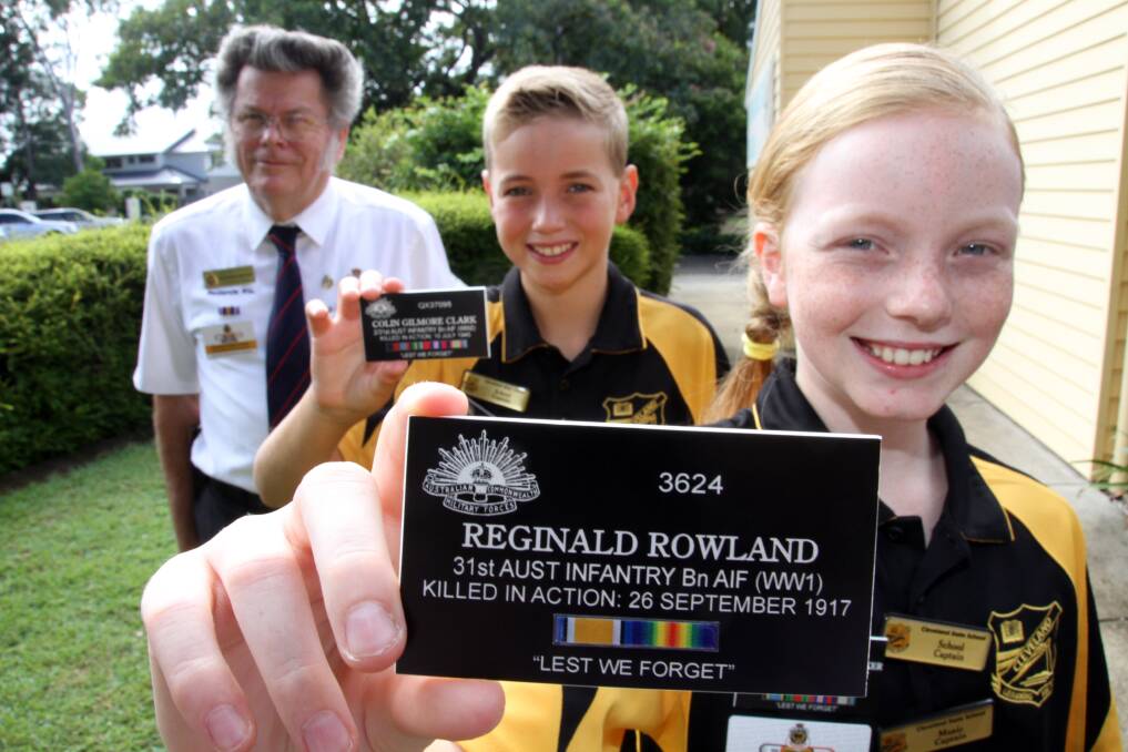 Cleveland State School grade 6 school captains Gracie Bedford and Alex Carew with some of the veteran tags presented by Graham Hinson- Redland RSL's Community Link officer.Photo by Chris McCormack