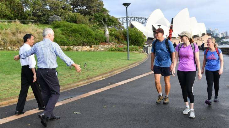 Indonesian President Joko Widodo and Prime Minister Malcolm Turnbull conduct "morning walk diplomacy" as they stroll through the Royal Botanic Garden in Sydney on Sunday. Photo: Indonesian President's Office