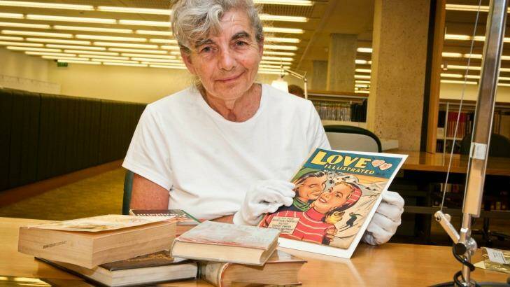 Queensland literature co-ordinator for the State Library, Joan Bruce, with some formerly banned books. Photo: Robert Shakespeare