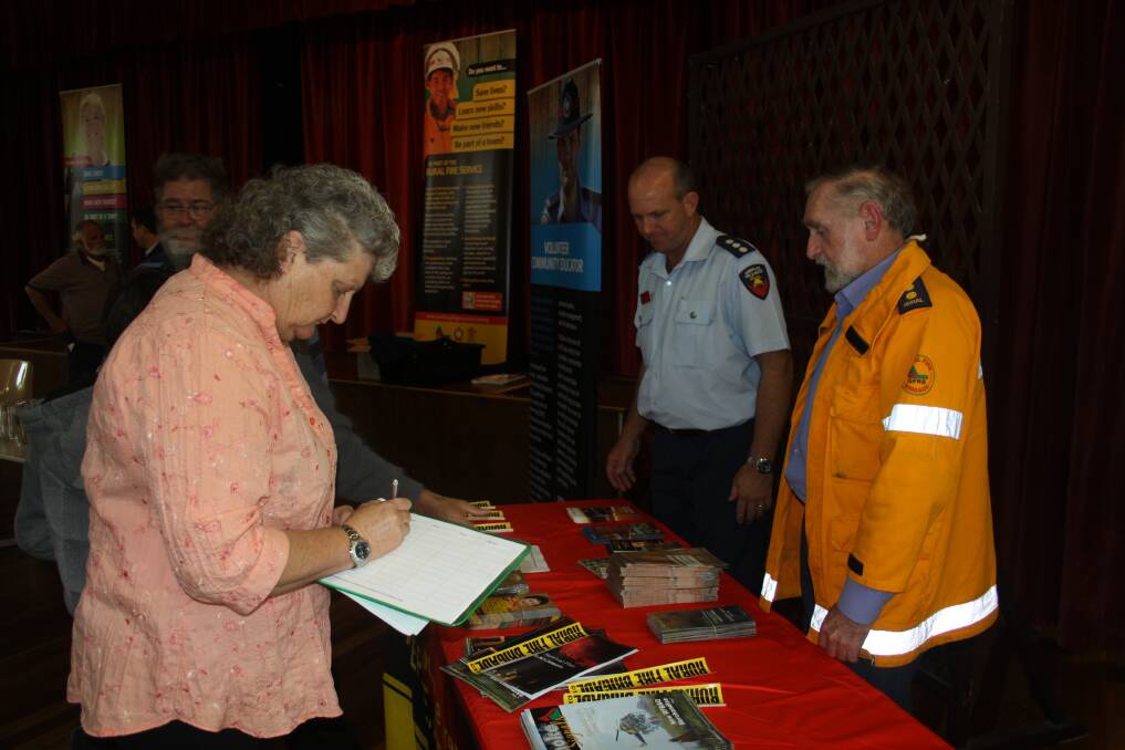 Straddie residents sign forms to show their interest in joining a rural fire brigade.