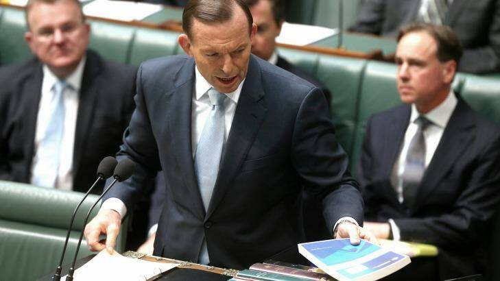 Prime Minister Tony Abbott tables in Parliament the royal commission's report on the Rudd government's home insulation scheme. Photo: Alex Ellinghausen