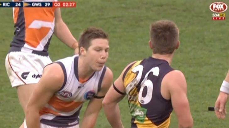 Toby Greene appears to spit at Anthony Miles. Photo: Fox Footy
