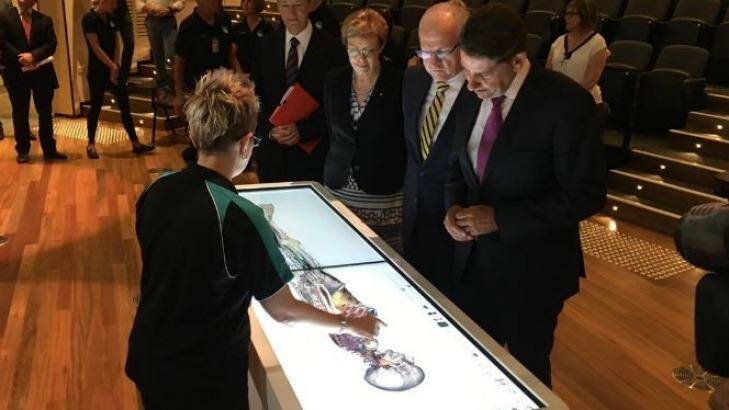 Queensland Health Minister Cameron Dick inspects a new 3-D medical imaging screen at the new Sunshine Coast University Medical Institute with mayor Mark Jamieson. Photo: supplied