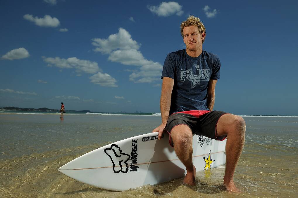 Australian professional surfer Bede Durbidge poses during a portrait shoot at Kirra beach on November 5, 2013 on the Gold Coast, Australia.