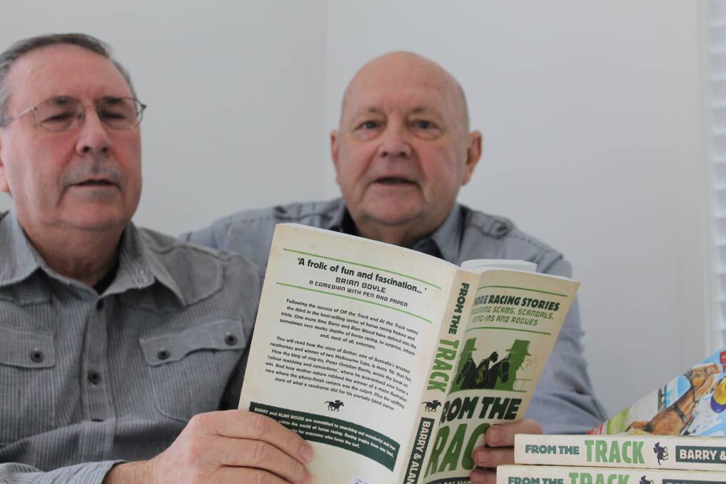 Brothers Barry and Alan Wood with copies of their latest book From the Track, which was presented to horse lover Queen Elizabeth II. Photo by Judith Kerr