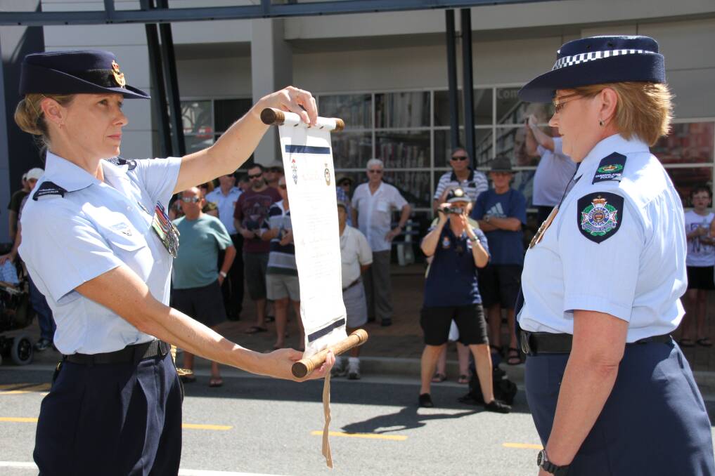 April 12 -Officer in Charge Senior Sergeant Janelle Harm stops the RAAF along Middle street, Cleveland during the RAAF freedom of entry to the City of Redlands.
Photo by Chris McCormack