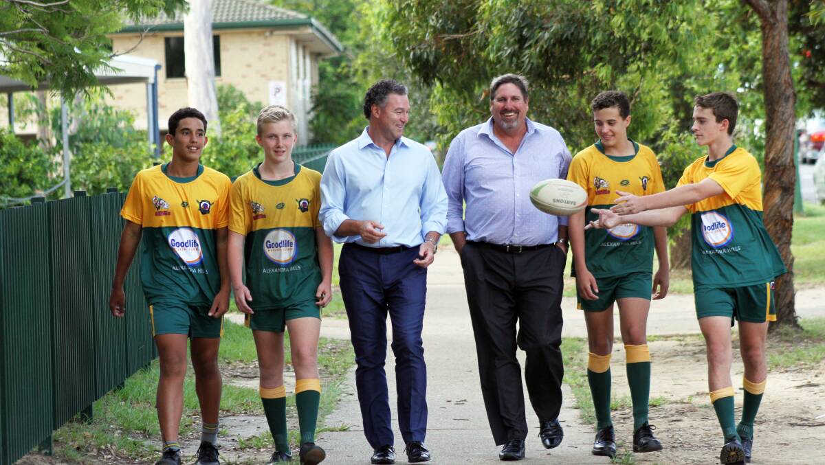 State education minister John-Paul Langbroek passes a ball between Alexandra Hills State School students from left - Tyrees Wilson, 13, Max Baumer, 14, Seth Mohr, 13 and Joseph Lewis, 14 together with Capalaba MP Steve Davies.
Photo by Chris McCormack