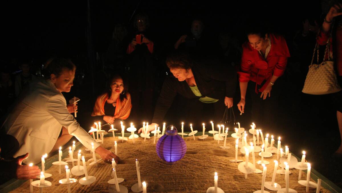 Redland City held a special candlelit vigil in May to raise awareness about domestic violence. PHOTO: Chris McCormack