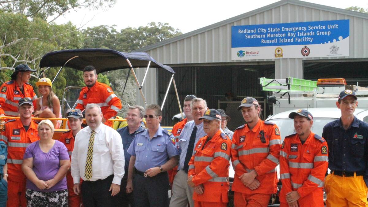 Police minister Jack Dempsey with some of the SES volunteers and Rural Fire Brigade volunteers outside the emergency services hub on Russell Island. PHOTO: Judith Kerr 