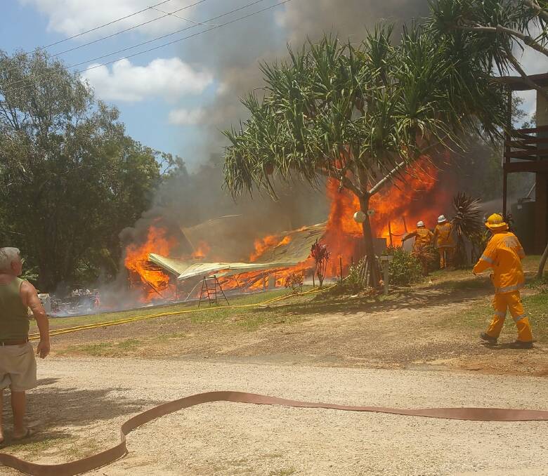 Firies fight the fire on Macleay Island which has left a family homeless over Christmas. PHOTOS: Lucy Celik