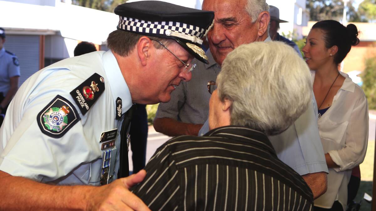 Police Commissioner Ian Stewart meets the crowd after the ceremony today which paid homage to police officers who died on duty. PHOTO: Stephen Archer 