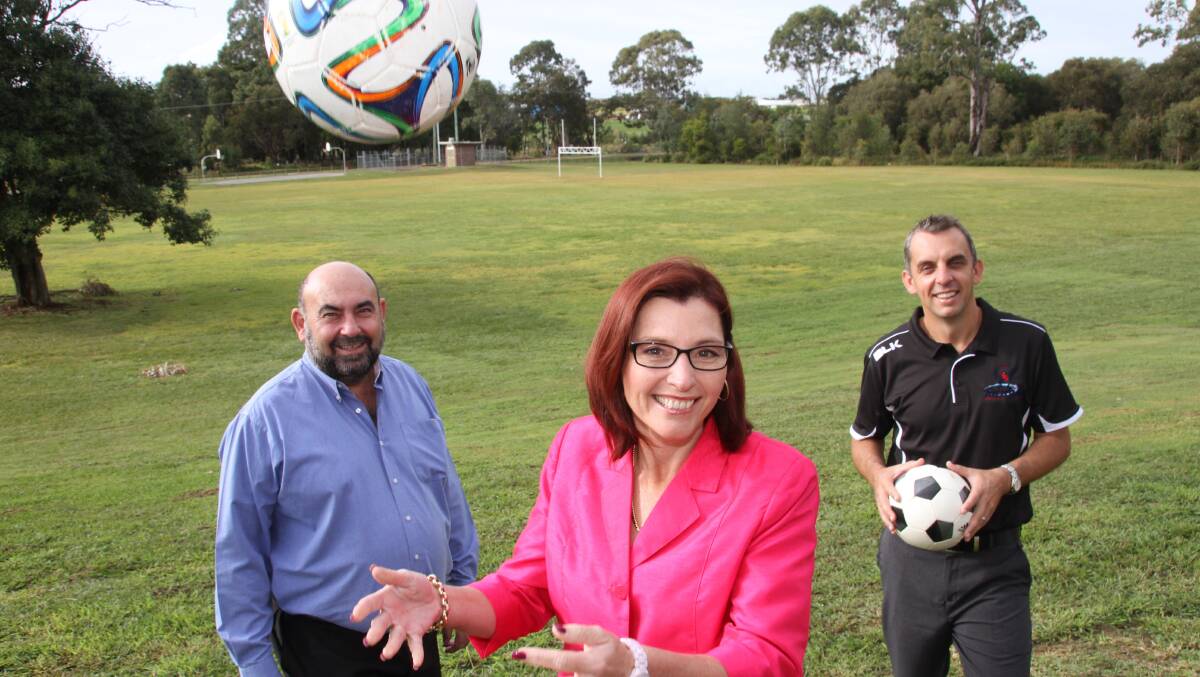 Redland councillors Julie Talty and ark Edwards, left, with Victoria Point Magic Football Club president Adam Carmichael. PHOTO: Chris McCormack 