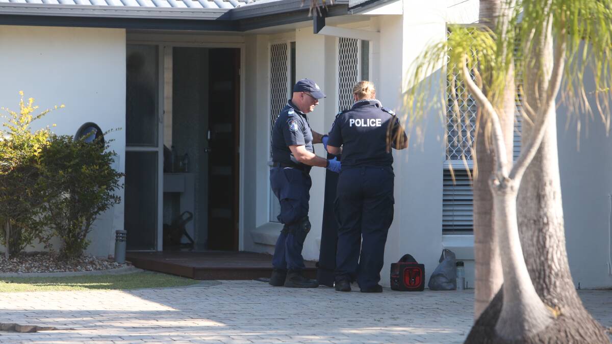 Police take materials from a Compass Court, Cleveland, home after exercising six search warrants this morning. PHOTO: Stephen Archer  