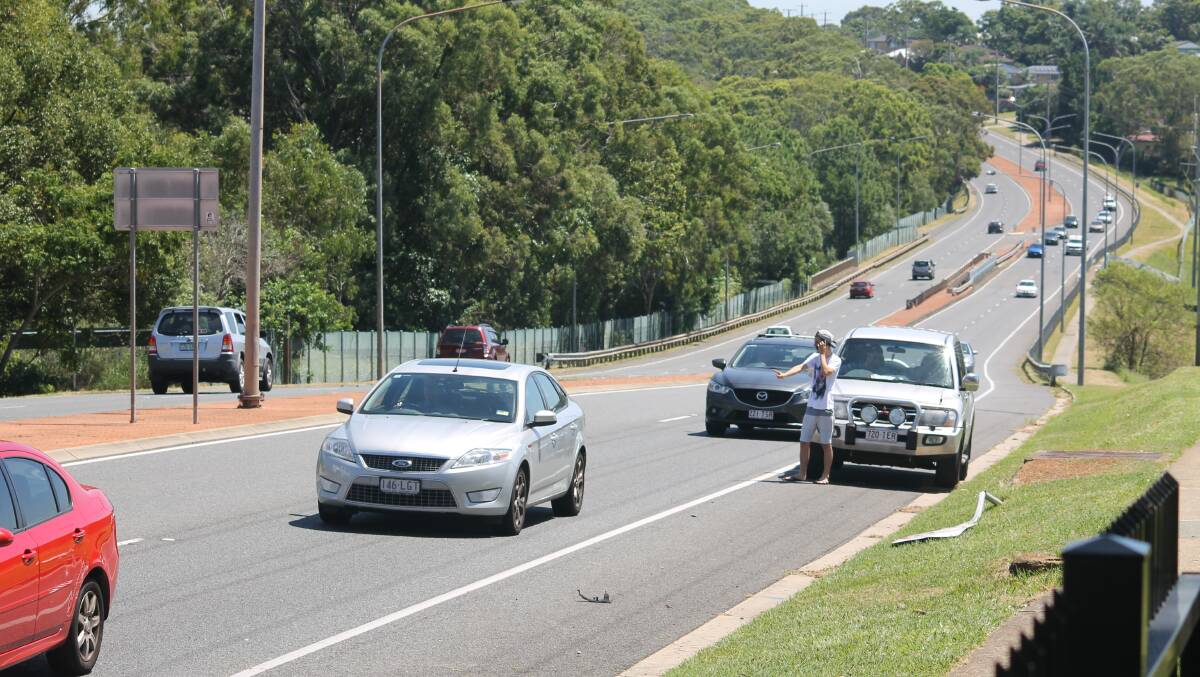 The broken traffic sign on Finucane Road where a car careened across the median strip and hit an oncoming vehicle on Thursday at 1pm. PHOTO: Brian Hurst 