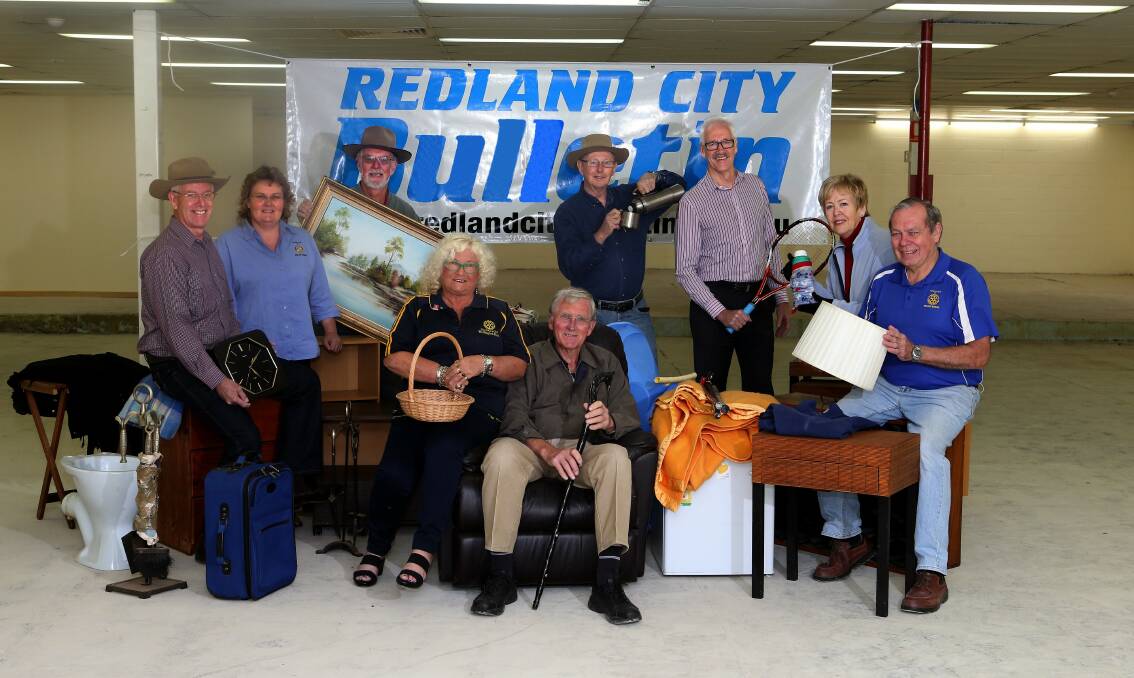 June 30 - Five Rotary Clubs of Bayside, Rotary garage sale to aid drought-stricken farmers out west. L-R Barry Melgaard of Wellington Point, Kathy Reimess of Alexandra Hills, Phil Pobinson of Ormiston, Lorraine Hooker of Wellington Point, Peter Moody of Birkdale, Dennis Head of Raby Bay, Gordon Lawrence, May Sheppard of Ormiston and Eddie Richards of Birkdale. 
