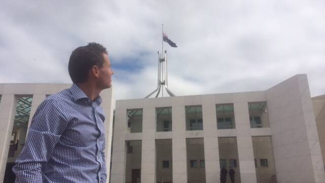 Bowman MP Andrew Laming outside Parliament House where the flag has been lowed to half-mast in homage to former Labor Prime Minister Gough Whitlam, who died this morning aged 98.

