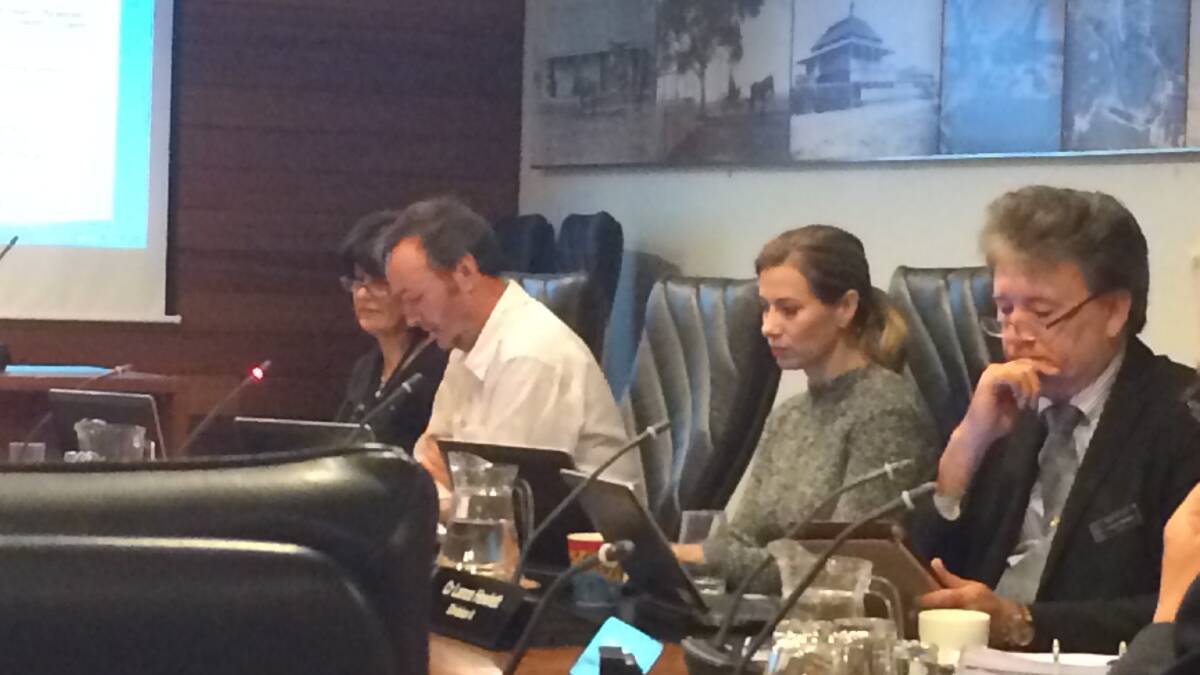 Redland City councillor Lance Hewlett, right, in council chambers