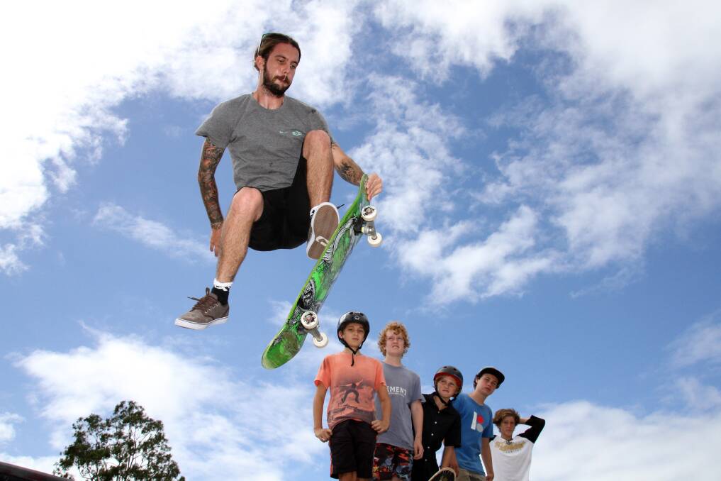 April 7 - Jim Dandy, Queensland State Manager of Skate Boarding Australia flies high as Chailyn Nogaski, 13, of Capalaba, Liam McGlynn, 13 of Redland Bay, Tom Gainger, 11 of Capalaba, Angus McCormack, 14 of Cleveland and James Cross, 14 of Redland Bay look on at William Stewart Park, Thornlands during the Redland City Council sponsored free skate lessons.
Photo by Chris McCormack