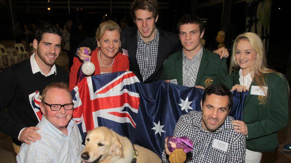 Sports and the Olympics have always been important to Redland mayor Karen Williams, pictured here paying tribute to the city's elite athletes in 2012, from left, shooter Bradley Mark, gymnast Thomas Pichler, swimmer Daniel Fox, wheelchair rugby captain Cameron Carr, judo expert Arnie Dickins and gymnast Larrissa Miller. Photos by CHRIS MCCORMACK