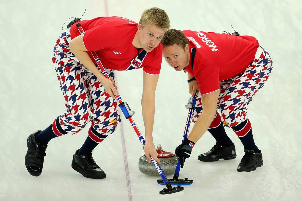 Haavard Vad Petersson and Torger Nergaard of Norway compete in the Curling Men's Round Robin match between Norway and Germany during day five of the Sochi 2014 Winter Olympics at Ice Cube Curling Center on February 12, 2014 in Sochi, Russia. Photo: GETTY IMAGES