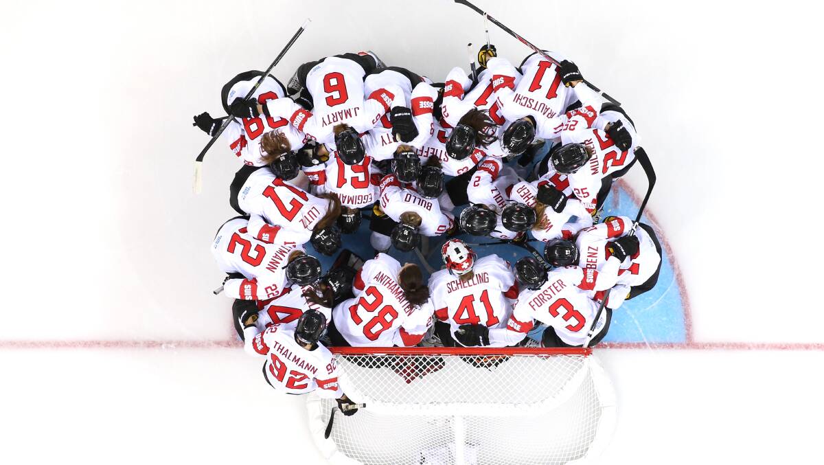 Team Switzerland gathers at the net prior to their Women's Ice Hockey Preliminary Round Group A game against Finland on day five of the Sochi 2014 Winter Olympics at Shayba Arena on February 12, 2014 in Sochi, Russia. Photo: GETTY IMAGES
