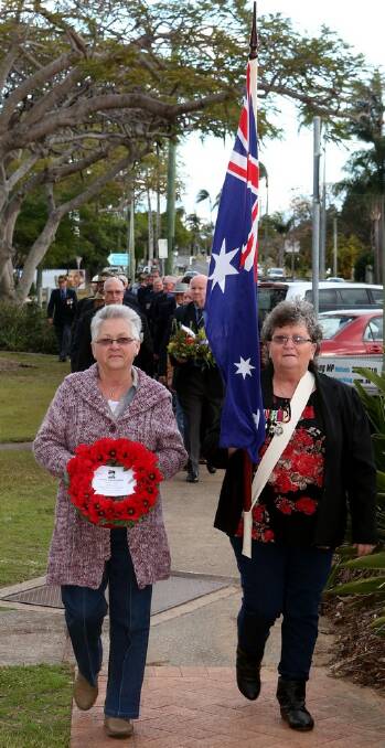 Ada Burns and Pat Withers lay a wreath at the Cleveland Cenotaph on Vietnam Veterans’ Day in memory of their brother, Leslie Prowse.