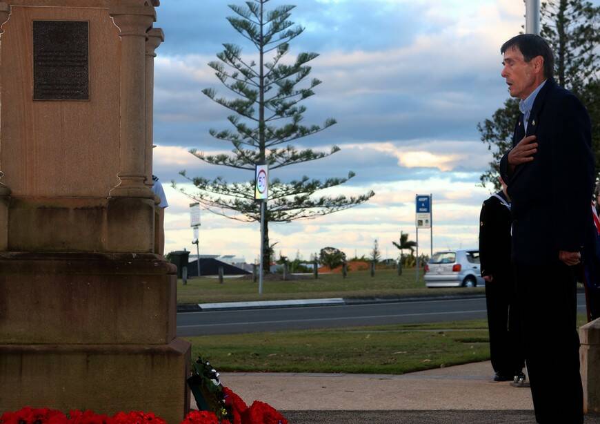 Joseph Wilcock pays his respects to the fallen at the Cleveland memorial.