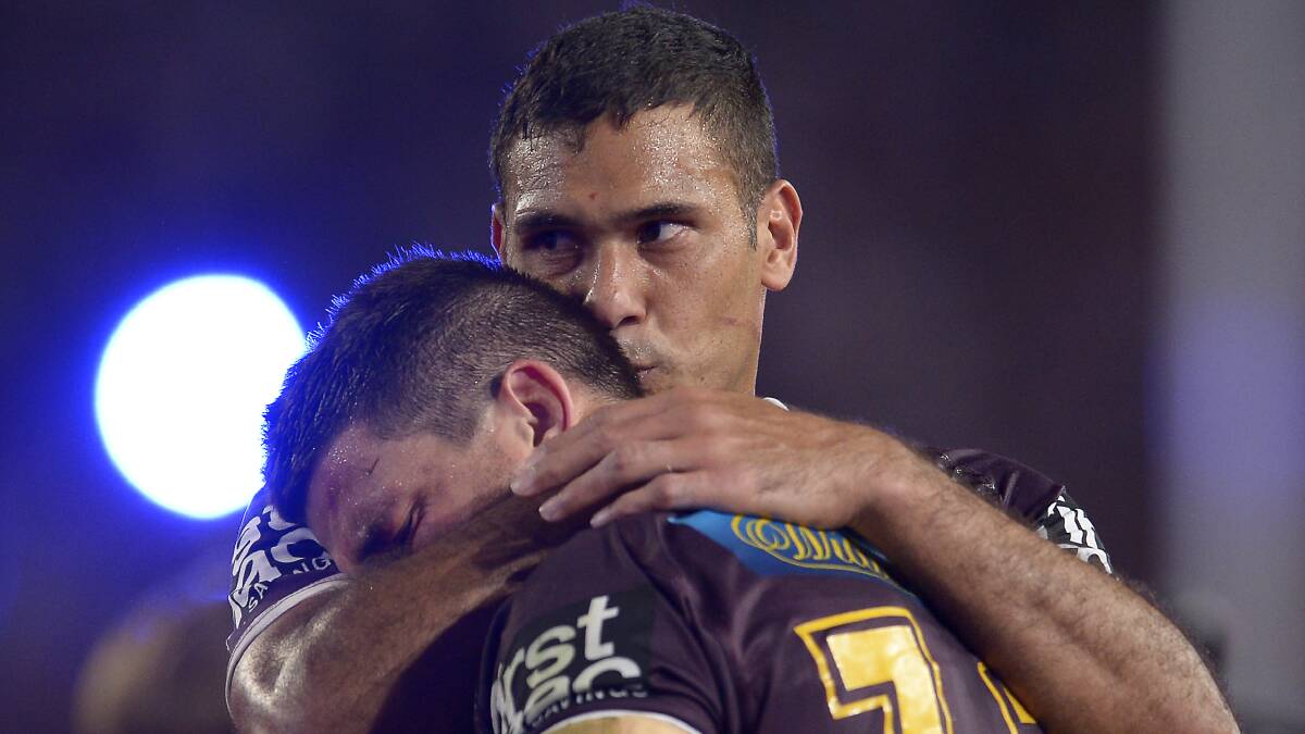 Justin Hodges consoles Matt Gillett of the Broncos after defeat during the 2015 NRL Grand Final match between the Brisbane Braoncos and the North Queensland Cowboys at ANZ Stadium on October 4, 2015 in Sydney, Australia. Photo by Brett Hemmings/Getty Images