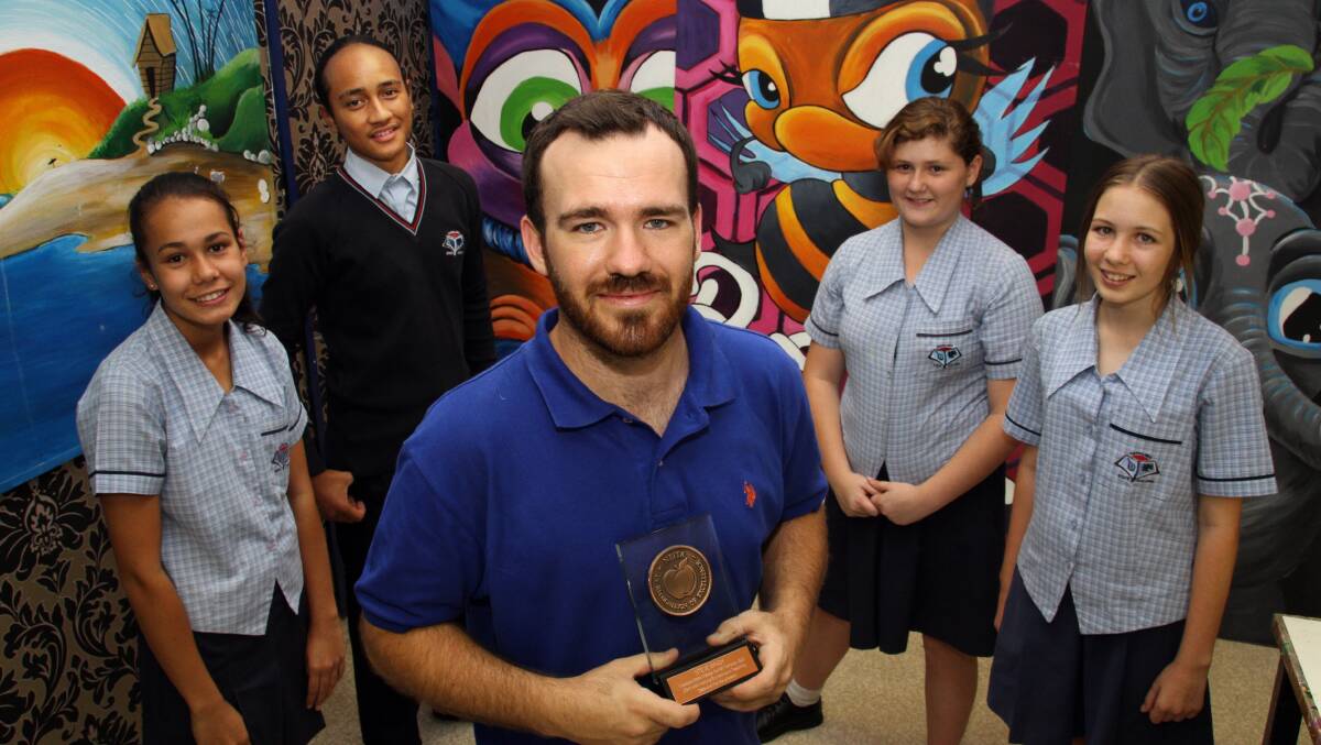 Capalaba State College Senior Campus teacher Steve Brady who received an National Excellence in Teaching Award with students Kayla Winiata, Marama Marino, Bellamy Smyth and Sarah Przybysz.
Photo by Chris McCormack
