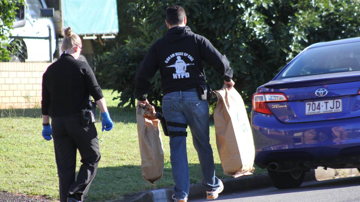 Police seize evidence after a raid in Ormiston on Tuesday morning. Photo by Chris McCormack.