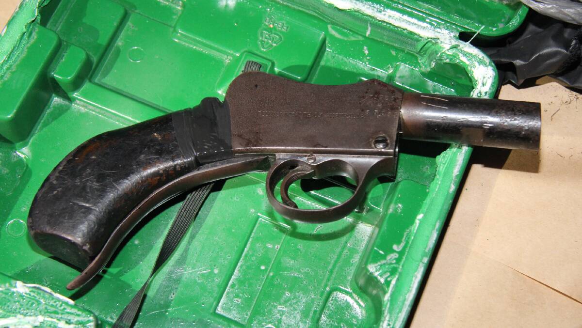 A pistol Taskforce Maxima allegedly uncovered during a raid. Photo: Queensland Police Service.