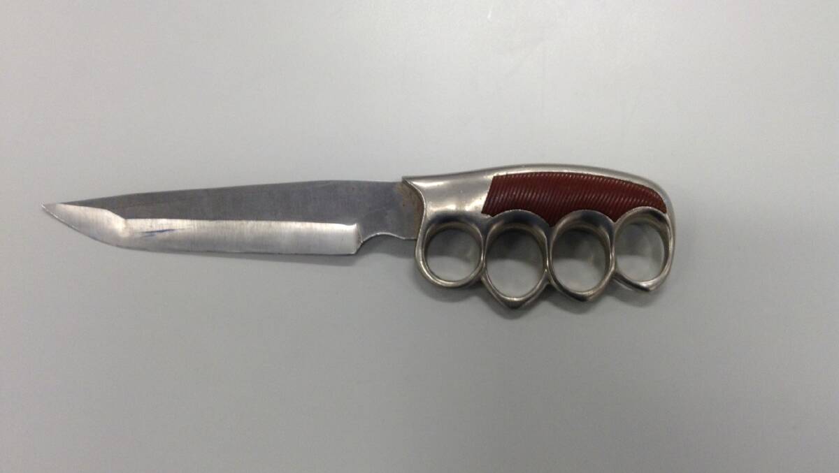A bladed knuckleduster allegedly found during a police raid in Alexandra Hills on Friday.