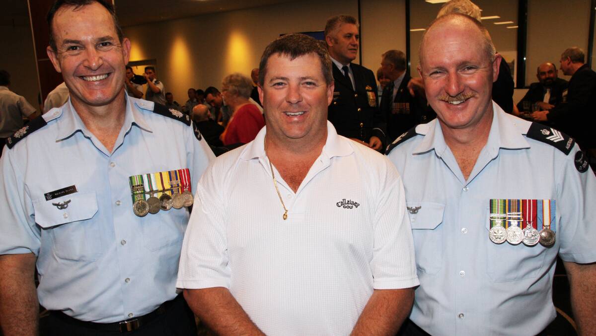 Michael Scott (295 Squadron), left, Paul Olsen, centre, of Wellington Point, and Peter Kirk (295 Squadron).
Photo by Chris McCormack