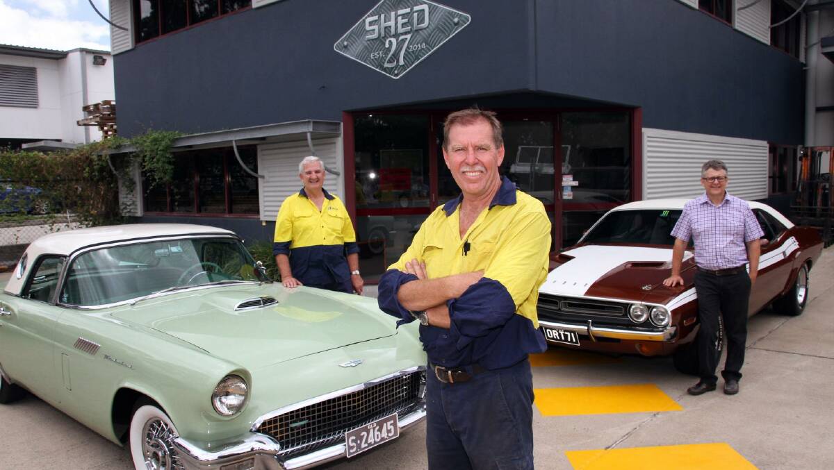 Shed 27 Men's Program coordinator Dave O' Keefe, left, and founders Shane Gilchrist, centre, and Steve Beaumont are seeking men of all ages to join the Men's Program  and enjoy some fun and mateship while restoring vintage vehicles. They are pictured at the Capalaba shed with Shane's restored 1957 Ford Thundebird, left, and restored 1971 Dodge Challenger.  Photo by Chris McCormack