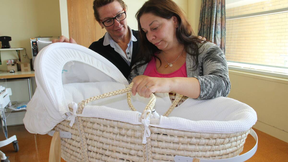 Redland Hospital Clinical nurse Trish Cottle with Kelly Newton who recently gave birth to her stillborn baby 'Amber'. She is raising money through Go Fund Me to buy a CuddleCot for Redland Hospital.
Photo by Chris McCormack
