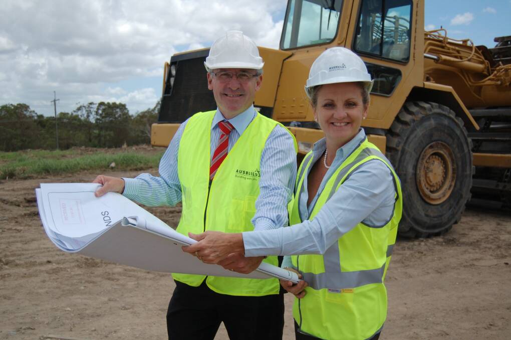 Ausbuild CEO Ron Loney shows Redland mayor Karen Williams plans for the first stage of his Kinross Estate. Photo: Kathryn Adams