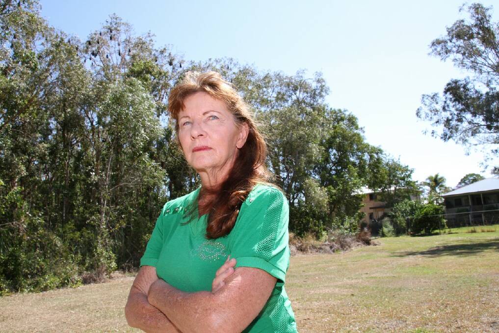Lyn Sloane wants the council to remove 30 per cent of the trees in a bat roost next to her Capalaba home.  
Photo by Chris McCormack