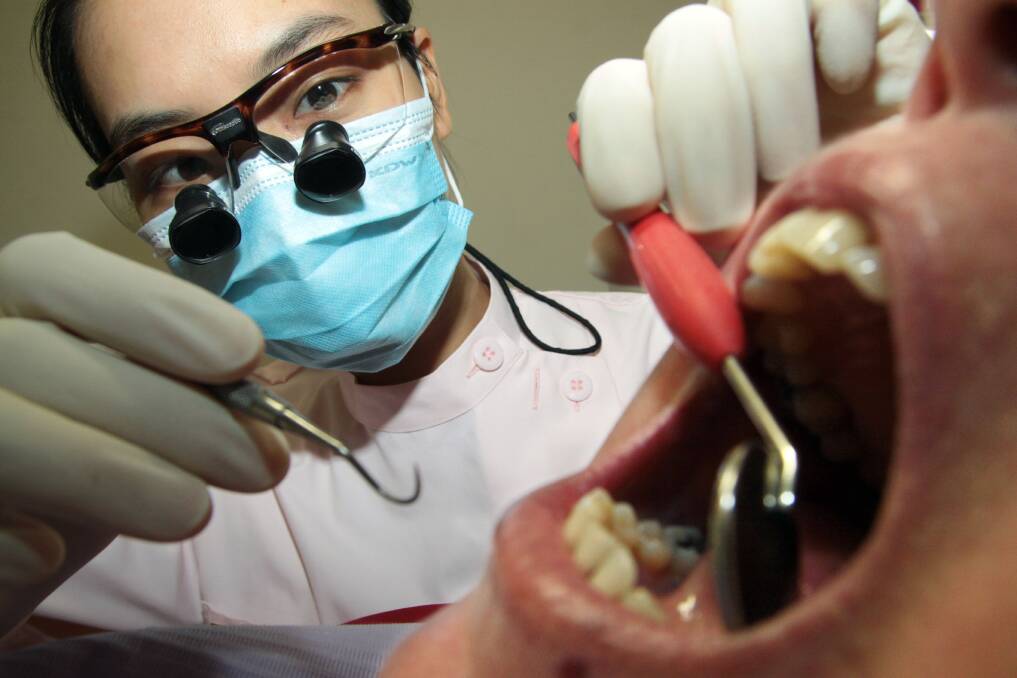 DEADLINE: Alexandra Hills Dental Practice dentist Esther Ko said dentists were working to finish off all dental work for those on the Chronic Disease Dental Scheme before the November 30 expiry date.  
Photo: Chris McCormack